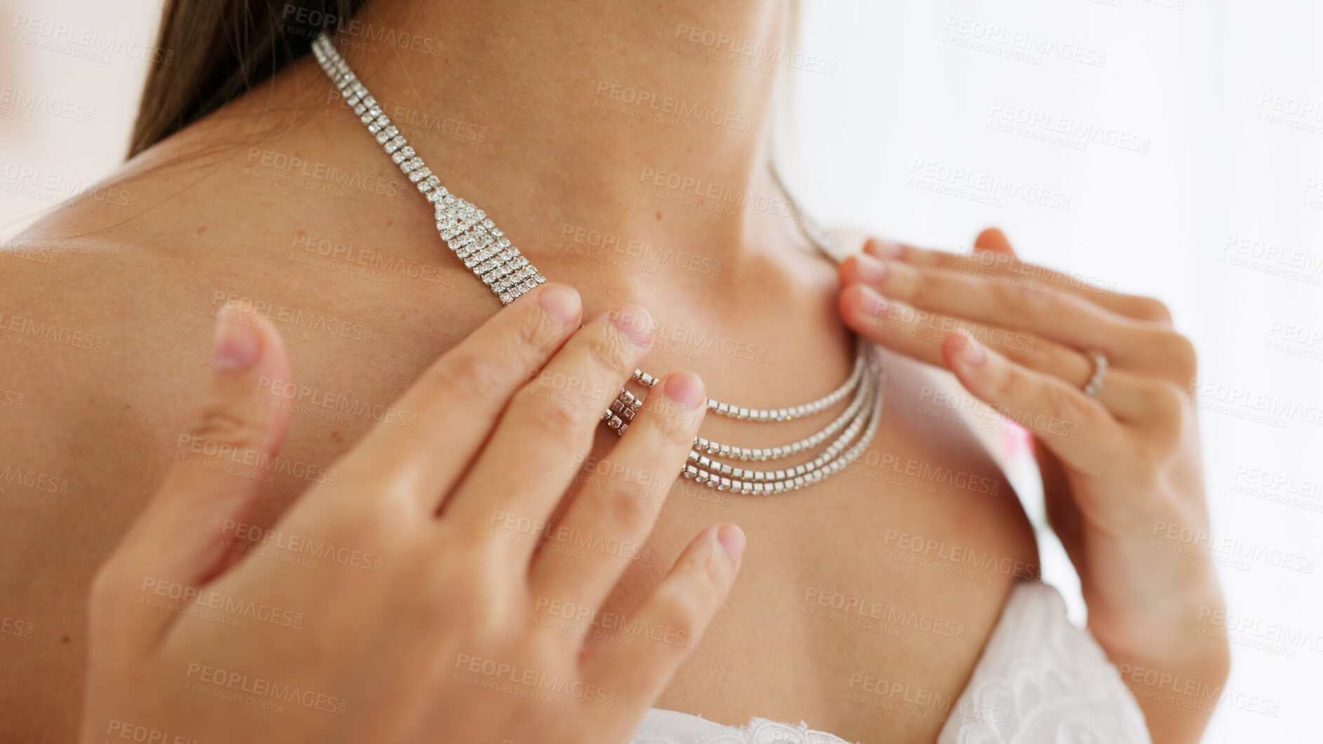 Buy stock photo Bride, jewelry and hands on diamond necklace on a woman getting ready for wedding event. Closeup, necklace or neck of rich person in silver bling with shine or classy fashion for marriage celebration