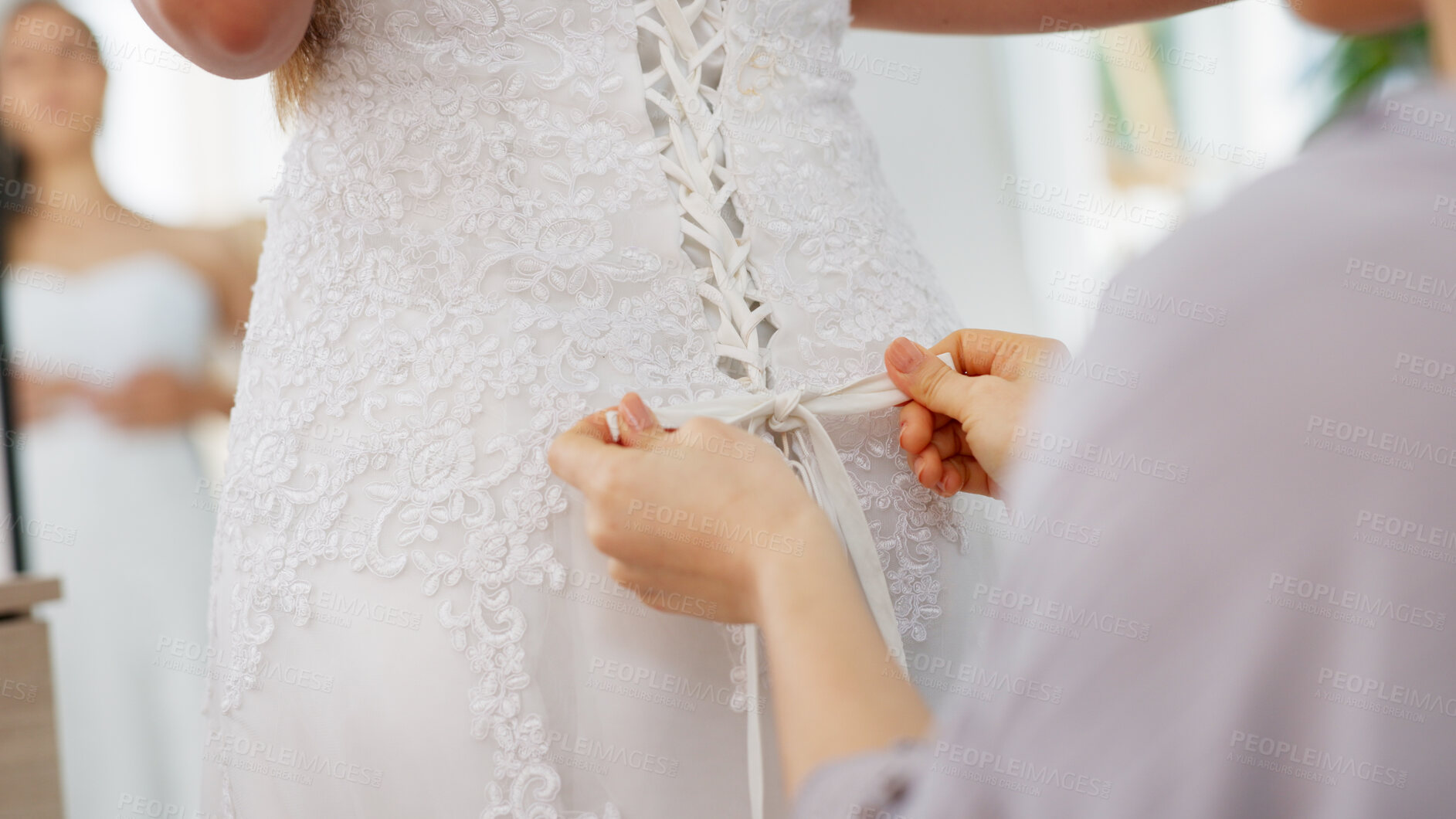 Buy stock photo Wedding dress, bride and hands lace for helping of woman fitting on gown at dressmaker in a shop, store or boutique. Fashion and bridal shopping with female customer with sales person tying knot