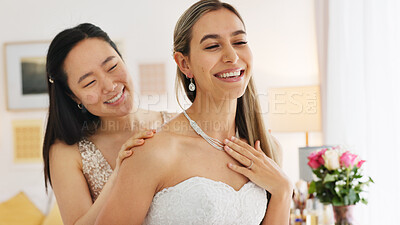 Wedding, friends and bride with necklace jewelry for beauty, wealth and luxury with happiness and fashion lifestyle. Happy women and bridesmaid in dressing room helping with silver diamond chain