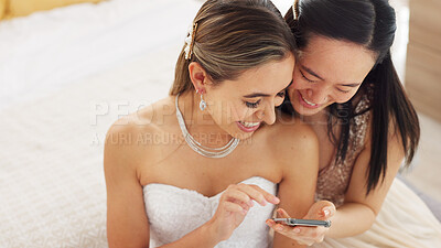 Friends, bride and bridesmaid smartphone selfie smile together for fun wedding photograph memory. Happy, joyful and cute women friendship with asian and caucasian woman looking at bridal pictures.