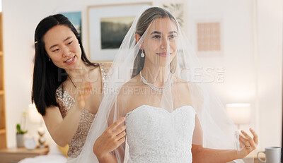 Bride, wedding and woman helping with veil in dressing room smile for special day. Happy women love and bridesmaid support or helping bride with fabric head piece for beauty, marriage and happiness