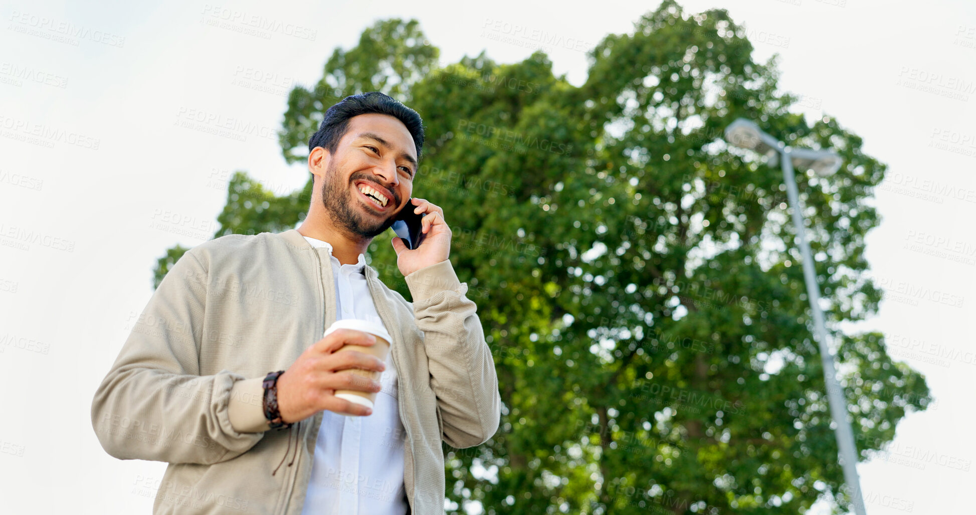 Buy stock photo Businessman, phone call and happiness in park for communication, promotion or success on walk to work. Man, walking and using smartphone for conversation, networking and winning with goals in morning