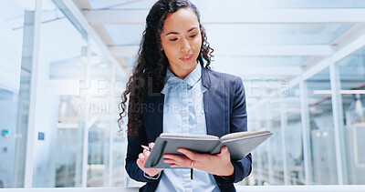 Business, woman and employee with notebook brainstorming, modern office and writing for research, data analysis and planning. Female entrepreneur, lady and ceo with digital marketing and brainstorming project with book