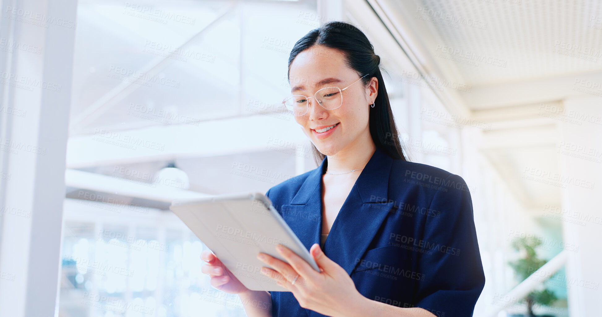 Buy stock photo Asian woman, tablet and research or technology with a smile at work in office for growth or development. Data, communication and search with a female employee checking her schedule or calendar online