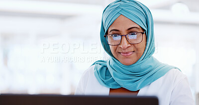 Muslim business woman, face and working at laptop, email and communication with focus and technology. Worker in hijab, corporate goals with internet, networking and research online for project