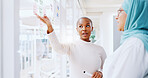 Teamwork, business people and leadership of black woman with sticky note in office workplace. Coaching, collaboration and female employees brainstorming sales or marketing strategy on glass wall.