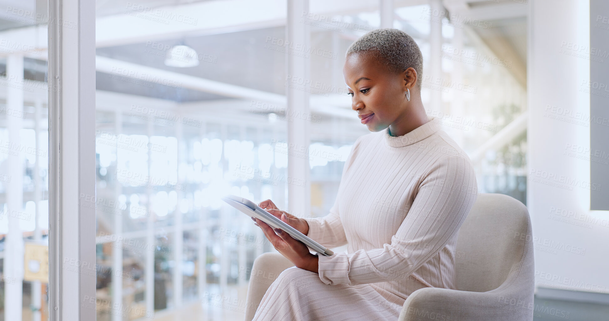 Buy stock photo Black woman, tablet and creative in research, social media or networking on chair at office. Happy African female person or employee working on technology in online search or startup at workplace