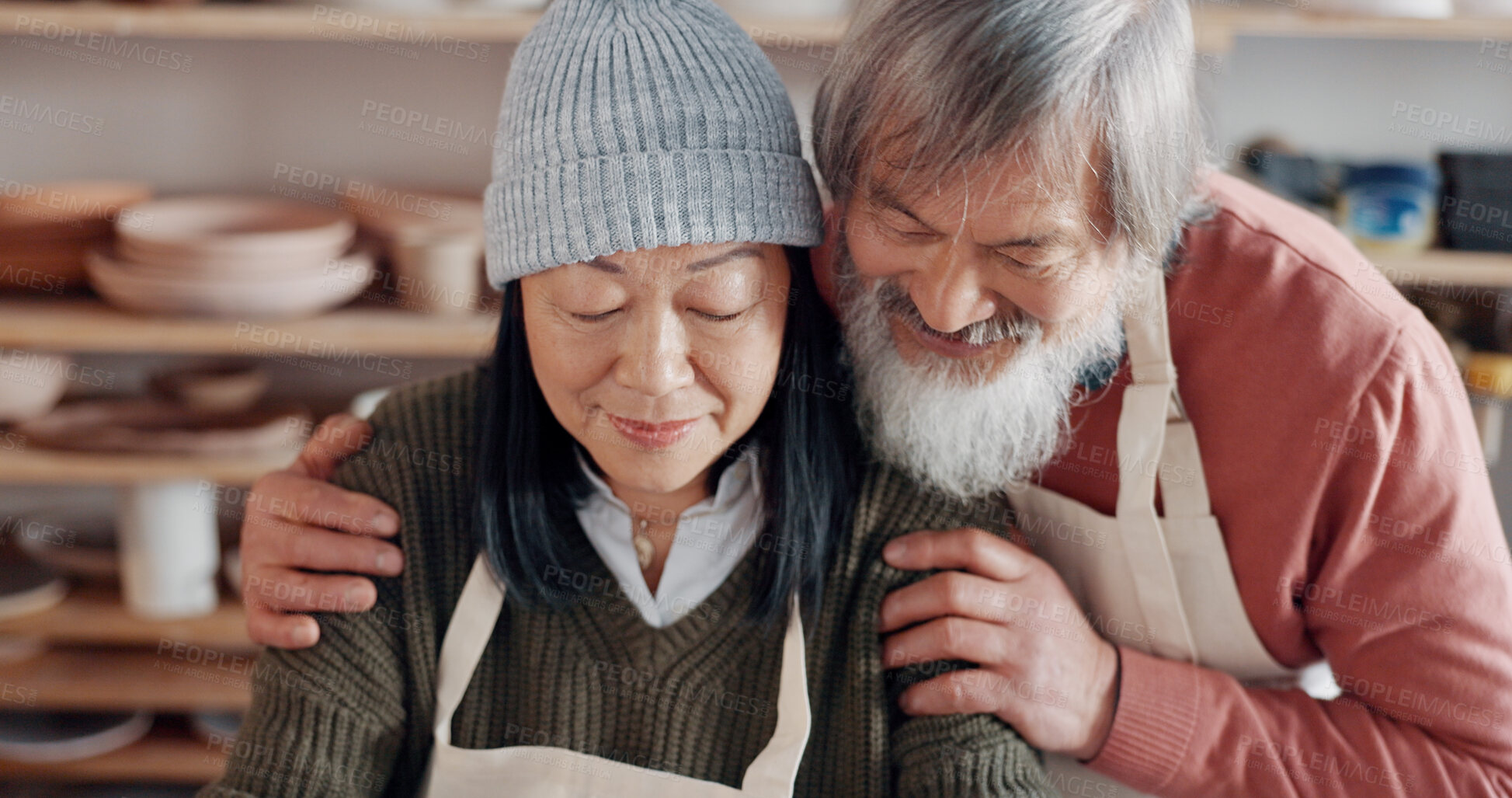 Buy stock photo Senior couple, hug and pottery studio work for clay sculpture, product manufacturing and mud design. Asian man, creative woman or retirement elderly in small business, workshop or Japanese art studio