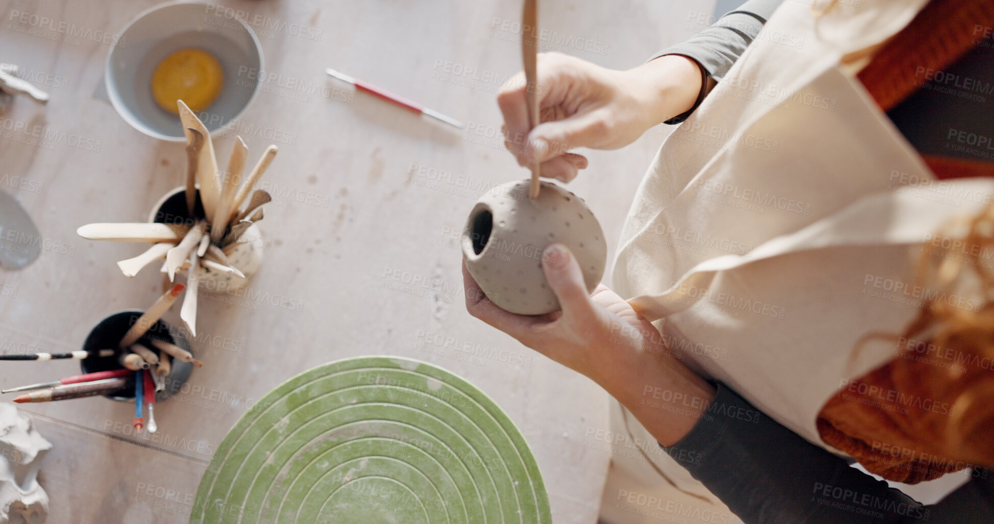Buy stock photo Pottery, art and hands to mold clay container in studio, workshop or classroom. Artist, craft process and hobby with creativity, person with unique mug or cup design, handmade ceramic bowl from above