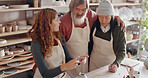 Art teacher, pottery and senior couple in a class, learning tips in art class. Young woman teaching old man  and old woman to roll clay, sculpture and giving instruction in studio to learn new skill in retirement