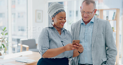 Woman, phone and businessman for social media, laughing and funny meme in finance office. Happy senior executive, black woman and smartphone for joke, social network or conversation on lunch at work