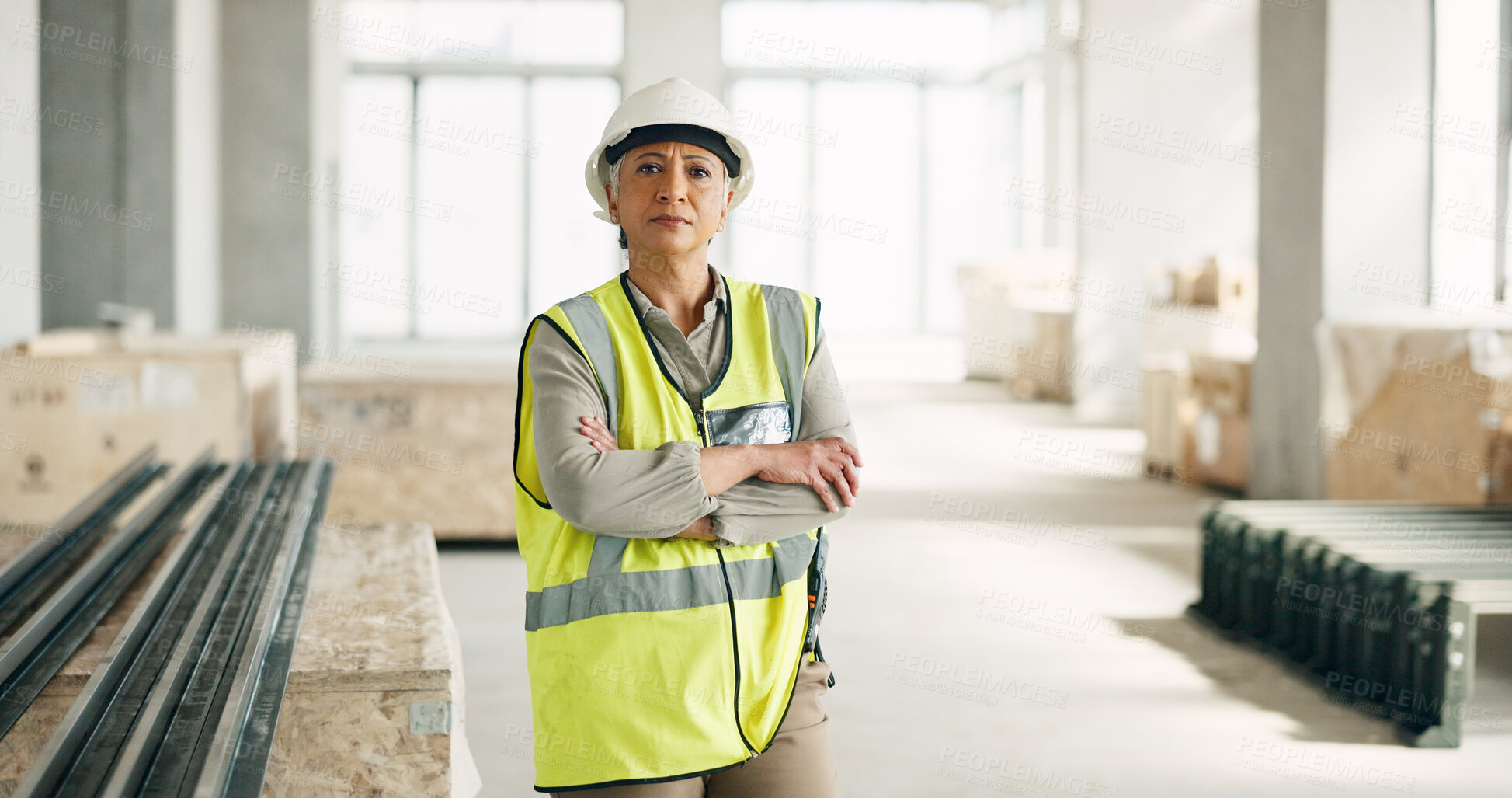 Buy stock photo Portrait, arms crossed and a senior woman construction worker on a building site for project management. Safety, industry and design with an architect, engineer or professional contractor at work