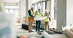 Building, construction and architect with a team working on site while reading a blueprint or plans indoors. Teamwork, engineer and architecture with a man and woman contractor group in collaboration