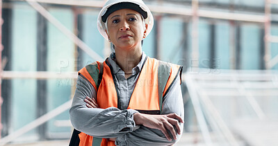Logistics, construction and architect working on management of a building at construction site. Portrait of a mature engineer in architecture with arms crossed during maintenance and industrial work