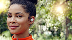 Brazilian woman, earphones and music in fitness workout, forest background training and nature park exercise. Face zoom, happy smile or runner with wellness sports goals, motivation and radio podcast