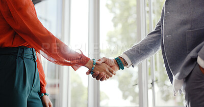 Closeup, handshake and businessman with woman, welcome or respect at meeting, workplace or interview. Business people, greeting and shaking hands in agreement, contract or thank you at finance agency