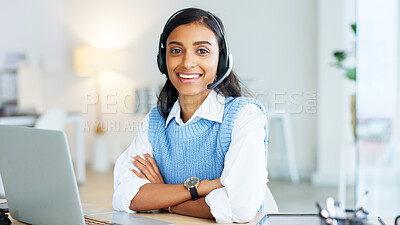 Portrait of a call center agent using a headset while consulting for customer service and sales support. Confident young businesswoman smiling while operating a helpdesk and looking confident