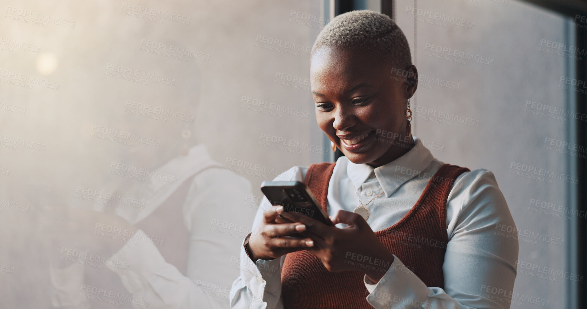 Buy stock photo Happy, window and a black woman on a phone at work for communication or social media. Technology, smile and African female employee networking on a mobile app or the internet on break in office