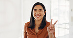 Business woman, face or peace sign in modern office, marketing company or advertising startup for Indonesian about us. Portrait, happy smile or fun hands gesture for creative designer