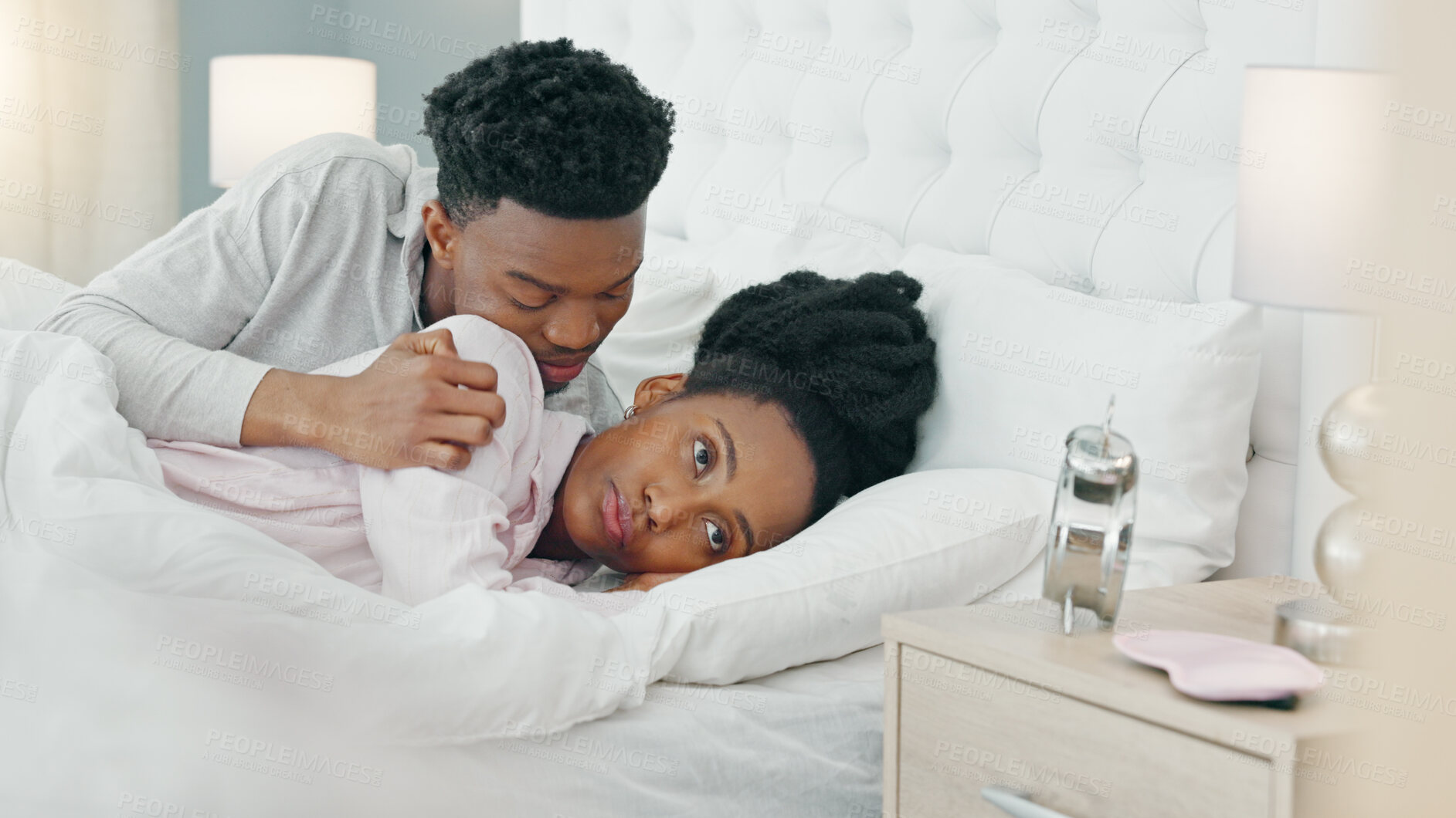 Buy stock photo Angry, guilt or apology with a black couple in bed together in a home after a fight, conflict or argument. Divorce, breakup or marriage problems with a frustrated woman and sorry man in the bedroom