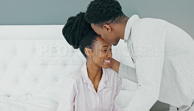 Breakfast in bed, love and black couple being romantic on their honeymoon, birthday or anniversary in a hotel room. Happy man kissing woman on head to express love and care while bonding in bedroom