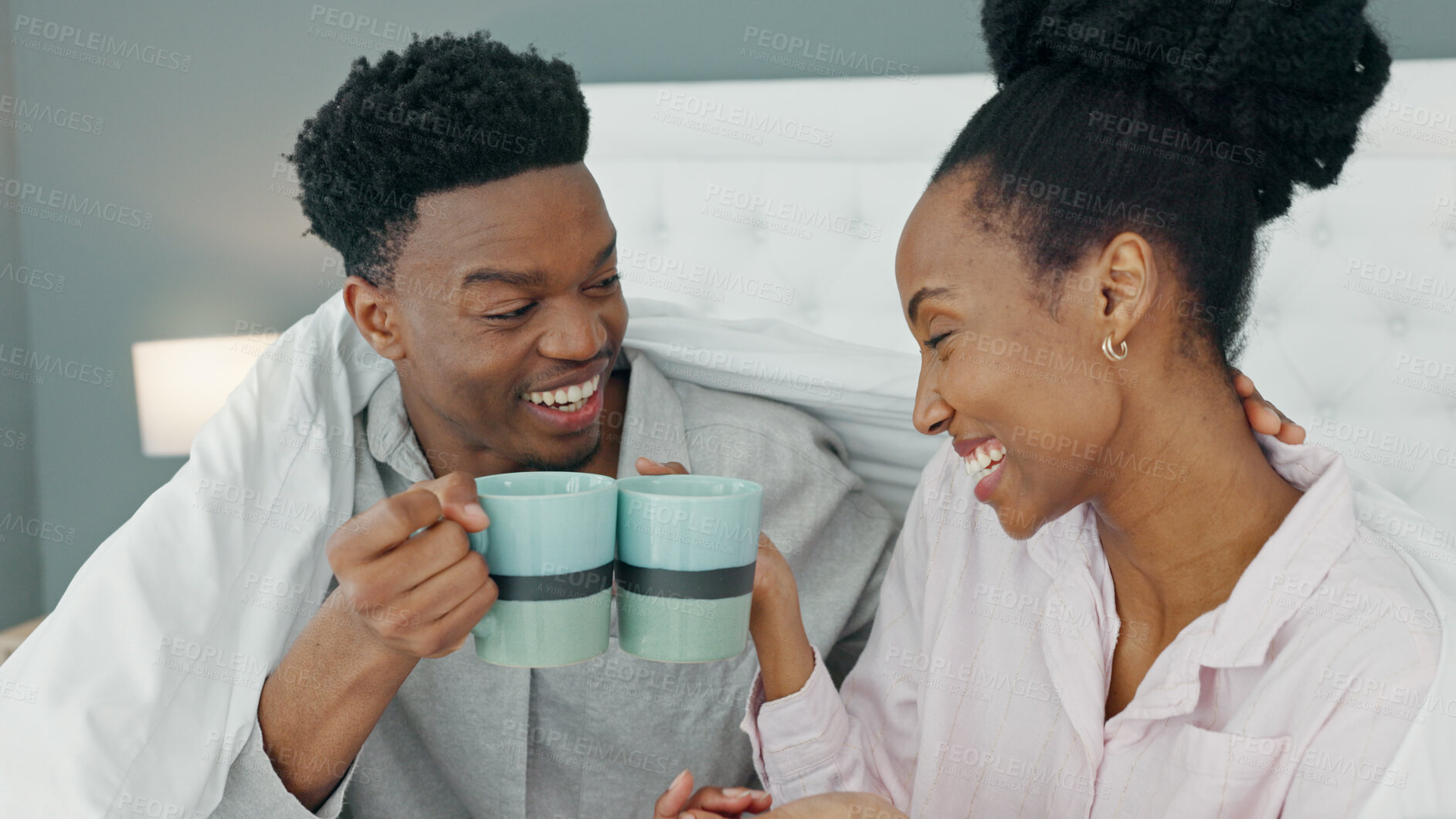 Buy stock photo Coffee, bed and couple cheers and relax in morning in their home bedroom together. Drink, tea and love of black man and woman with care, comfort and toast to celebrate healthy and happy marriage