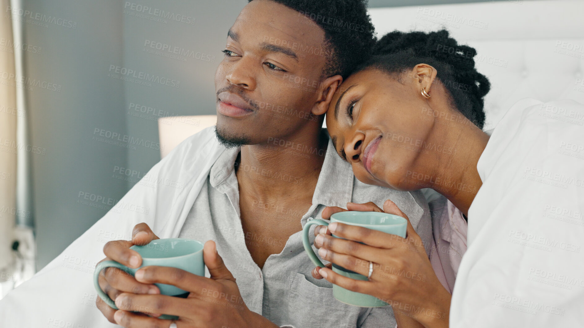 Buy stock photo Love, couple and coffee in the morning for relax, happiness and care while looking at view from bedroom of home. 
Romance, black woman and man in room embrace for commitment and healthy marriage
