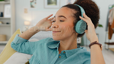 Buy stock photo Woman, headphones and listening to music in her home, podcast or radio with calm and smile for wellness. Relax, self care and happy in apartment, technology for audio streaming and connectivity