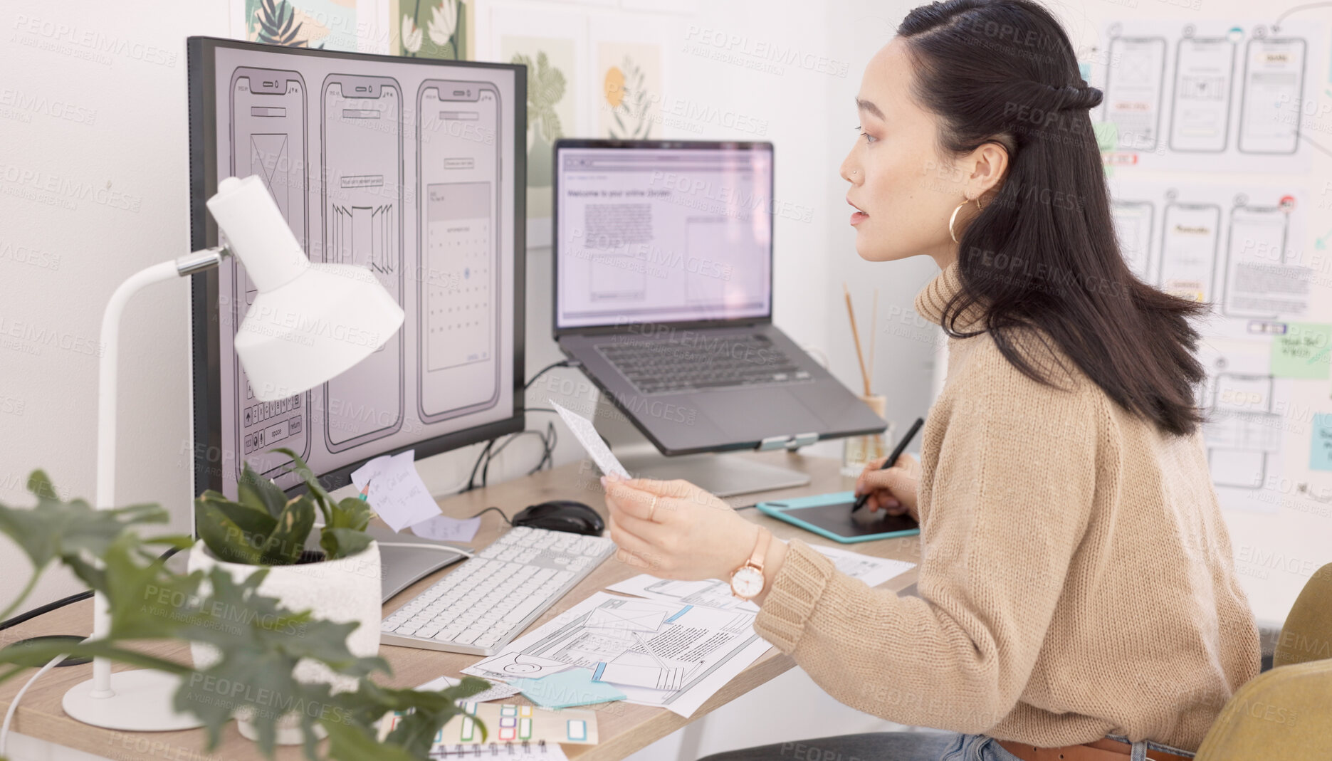 Buy stock photo Computer, phone design and a business asian woman at work in her office on technology development. Planning, creative and hardware with a young employee working on a graphic model of a mobile product