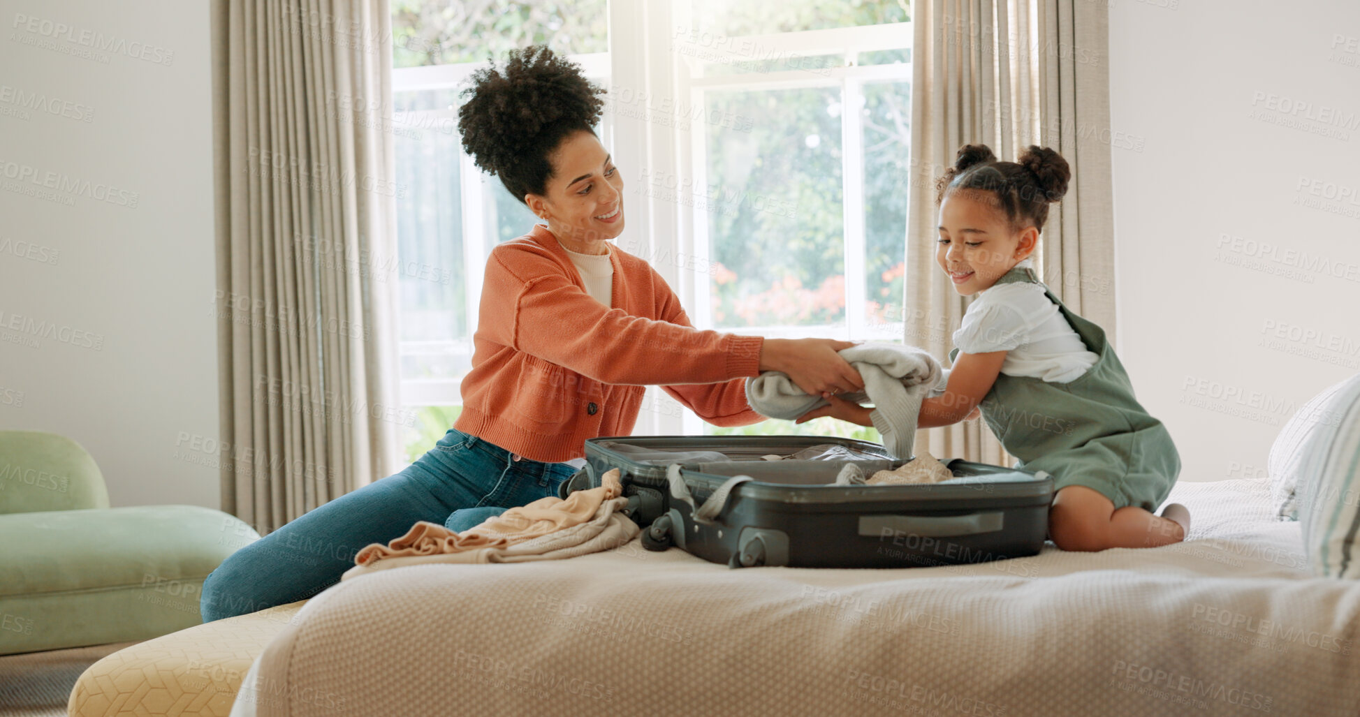 Buy stock photo Mother, child and packing suitcase in home bedroom together for travel trip and ready for family vacation. Happy African woman or parent with girl kid on hotel bed with clothes or luggage for holiday