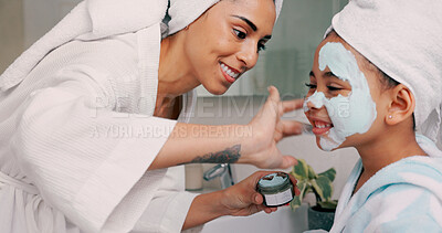 Mom, daughter and home skincare face mask of family bonding together with a house spa day. Mama and girl with beauty treatment, facial serum and skin moisterizer cream looking happy with a smile