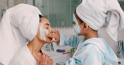 Family, facial and mask with mother in bathroom with young child using hand to apply cosmetics. Wellness, black family and face cosmetic pamper treatment with kid and mama in happy home.