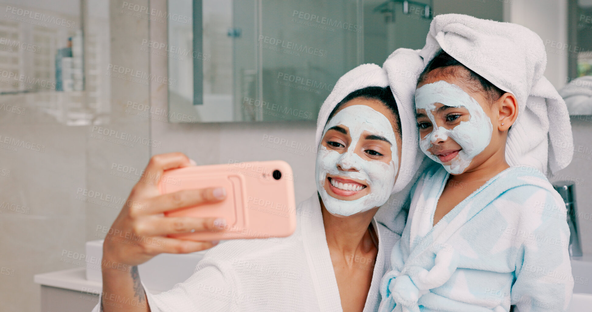 Buy stock photo Selfie, facial and mother and daughter in home bathroom together for a spa day. Social media, profile picture and photograph with a woman and girl child or family with skincare mask and smile on face