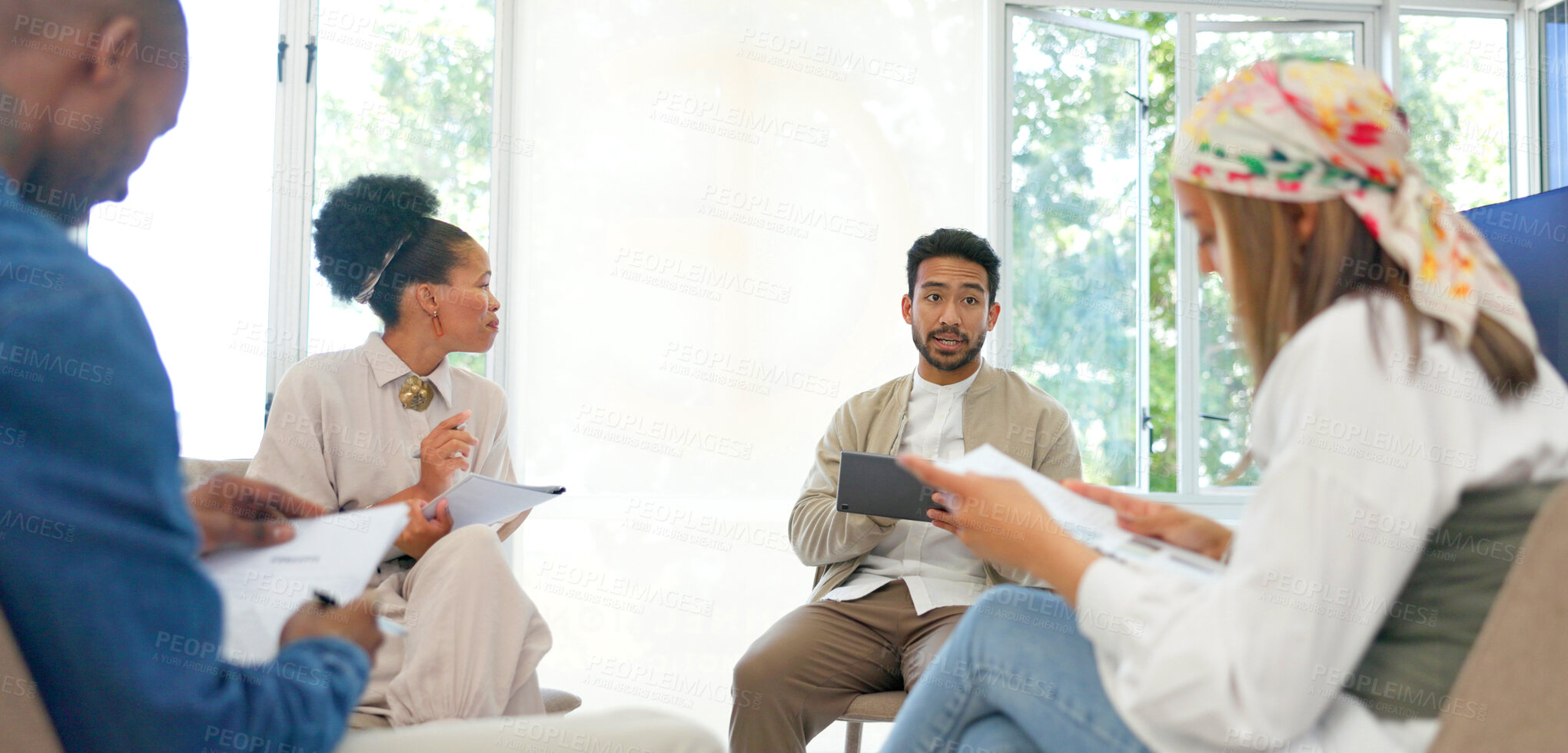 Buy stock photo Business people in meeting, circle and team at workshop, seminar or training in startup. Group, collaboration or creative designer planning strategy, discussion or brainstorming on tech with document