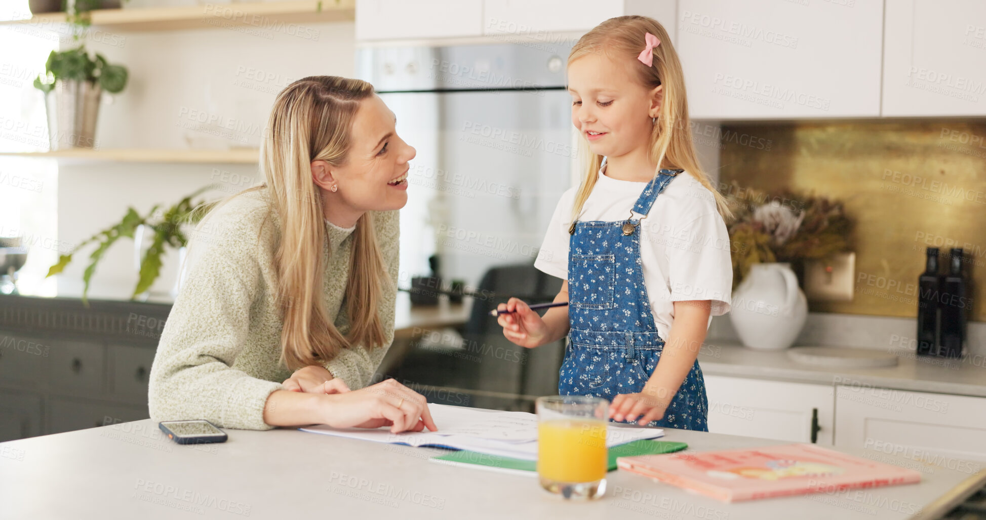 Buy stock photo Education, support and mom with child for homeschool, teaching and learning, development and help with homework. Home study, happy mother and girl with kindergarten project in notebook in kitchen.