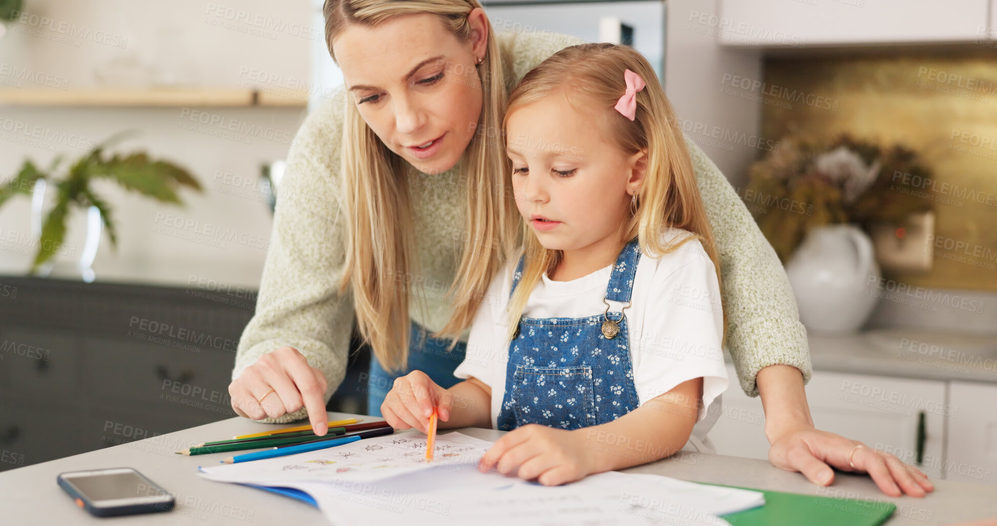 Buy stock photo Education, homeschool and mom helping kid, teaching and learning, child development and homework. Home study, happy mother and girl writing for kindergarten project in notebook on kitchen counter.