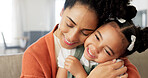 Happy, mother and child with hug, kiss and love for playful relationship bonding on living room sofa at home. Mama and kid playing together in happiness for loving care or joy relaxing on the couch