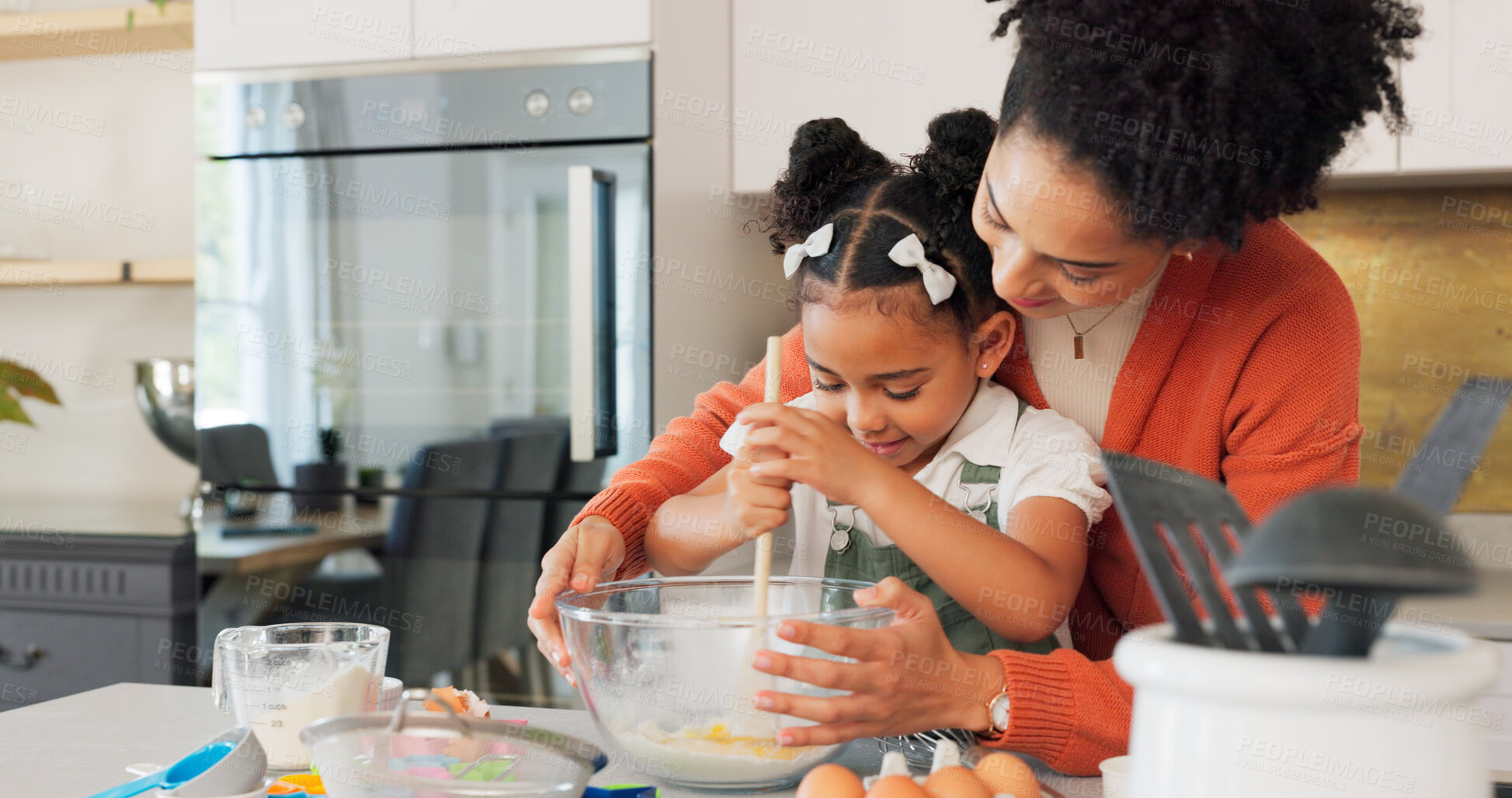 Buy stock photo Baking, kitchen and mother with girl learning, helping and bonding for recipe, food and dessert. Happy family, African and mom teaching girl to bake with flour, mix ingredients and cake in home