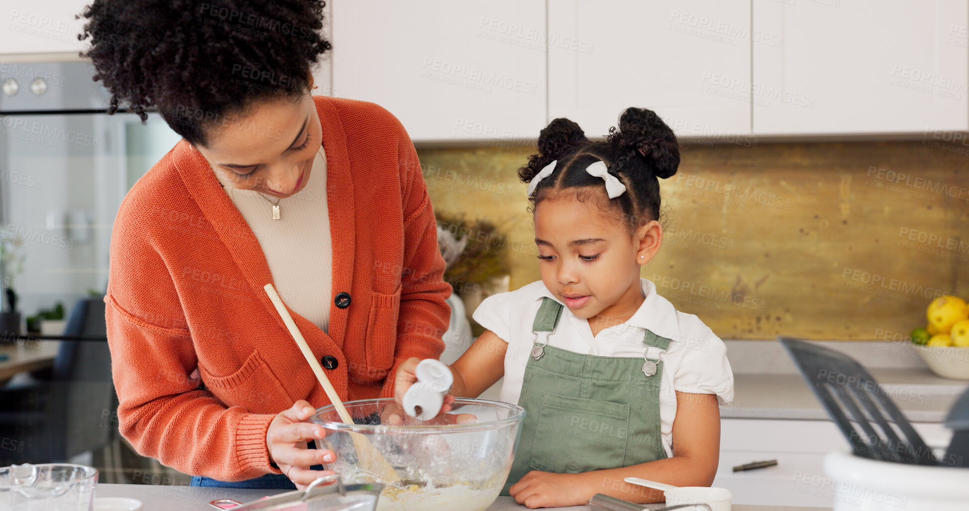 Buy stock photo Baking, cooking and mother with child in kitchen helping for recipe, food and dessert. Happy family, African parents and mom teaching girl to bake with flour, ingredients and cake bonding in home