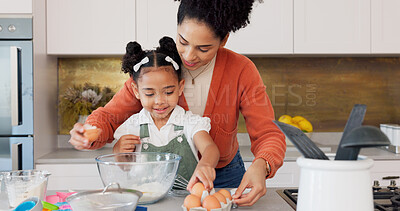 Mother, child and baking with eggs in the kitchen for family bonding, learning and fun with ingredients at home. Happy mom teaching helpful kid to bake, cook or mix for recipe together at the house