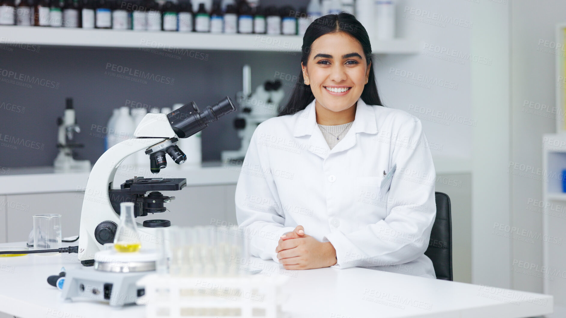 Buy stock photo Science, research and portrait of happy woman with microscope, medical innovation and biotech at laboratory. Medicine, virus development and smile, expert scientist or lab technician in clinic study.