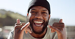 Portrait, black man and hand, good times sign in a city, smile, relax and happy with freedom, positive and energy. Face, man and shaka hands by African in New York for travel, fun and leisure trip