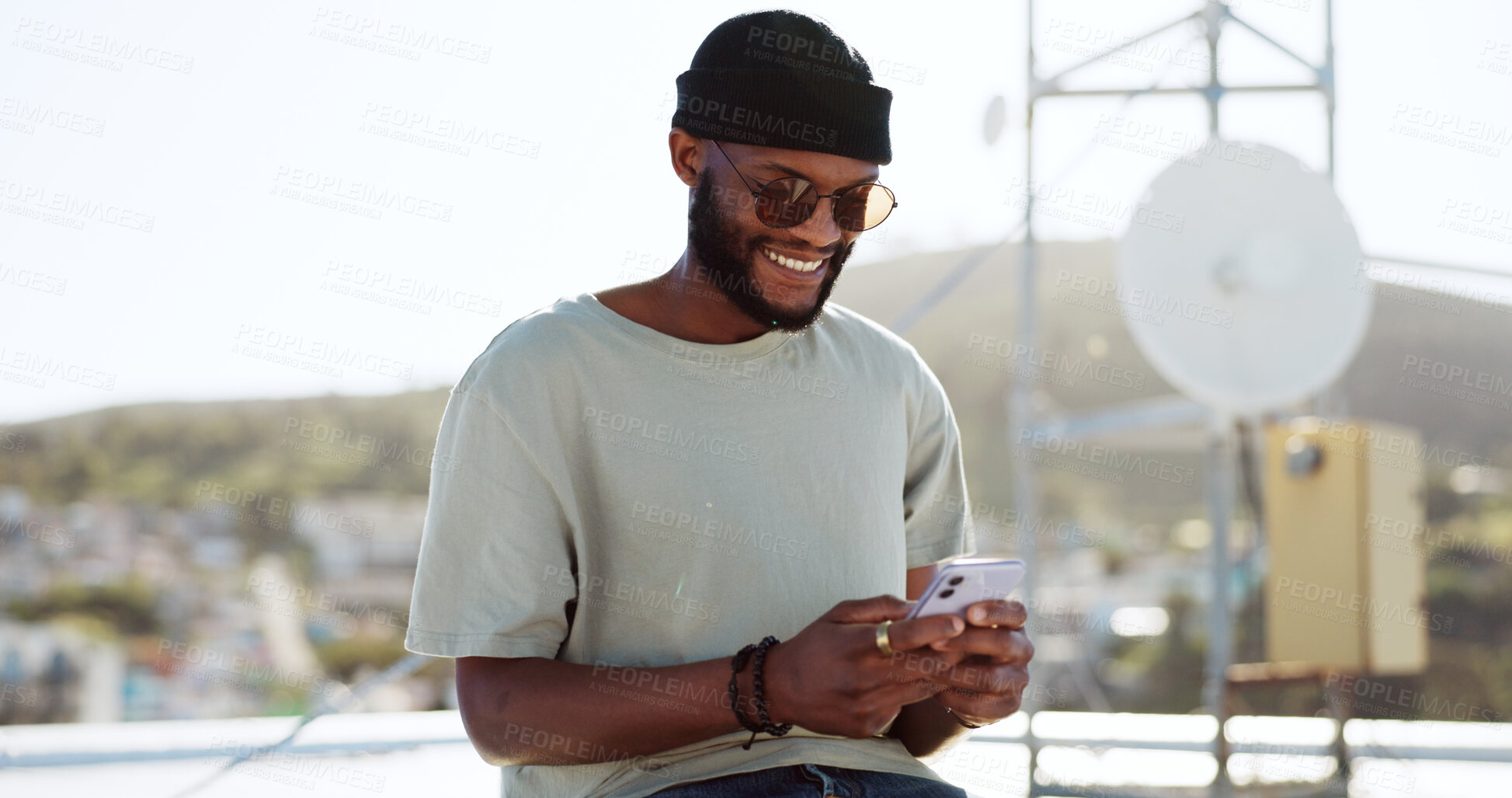 Buy stock photo Black man, smartphone and chat, social media and typing outdoor with internet search and online communication. Smile, urban and technology, using phone and mobile app with contact in the city