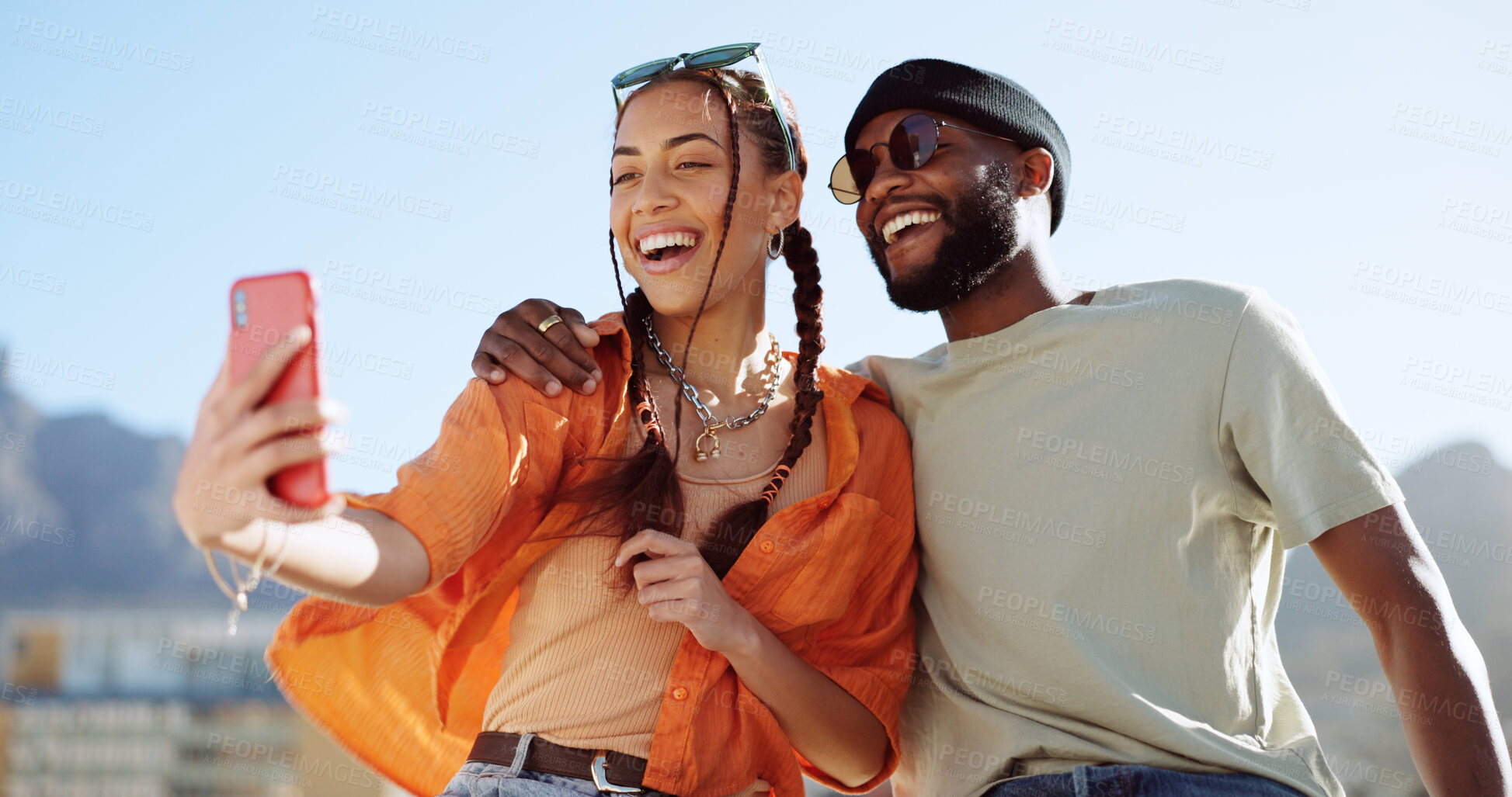Buy stock photo Couple of friends, rooftop and city selfie, smile and youth in happy social bonding on summer sky. Photography, gen z man and influencer woman on roof with hug, love and relax on urban date together.