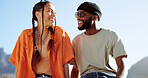Peace, love and couple in the city to relax, smile and be happy together in summer. Portrait of an urban and interracial man and woman with hand sign for communication and comedy against a blue sky