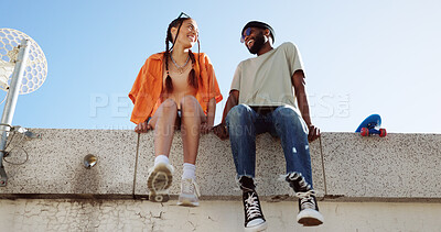 Cool, fashion and joke with young couple hang out on city building together bonding. Interracial stylish young people on a funny city date. Silly, goofy and laughing black man and woman joking