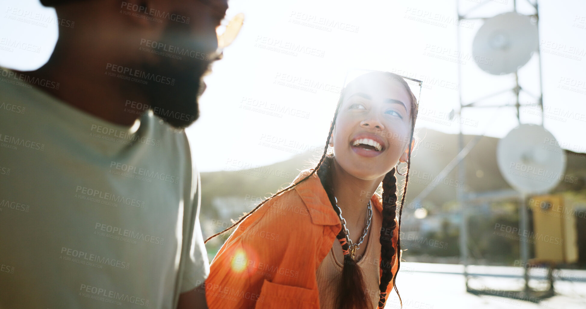 Buy stock photo Man, woman and rooftop date on city building, talking and youth in happy bonding with summer sky. Diversity, couple of gen z friends sitting on roof with smile and relax at urban social together.