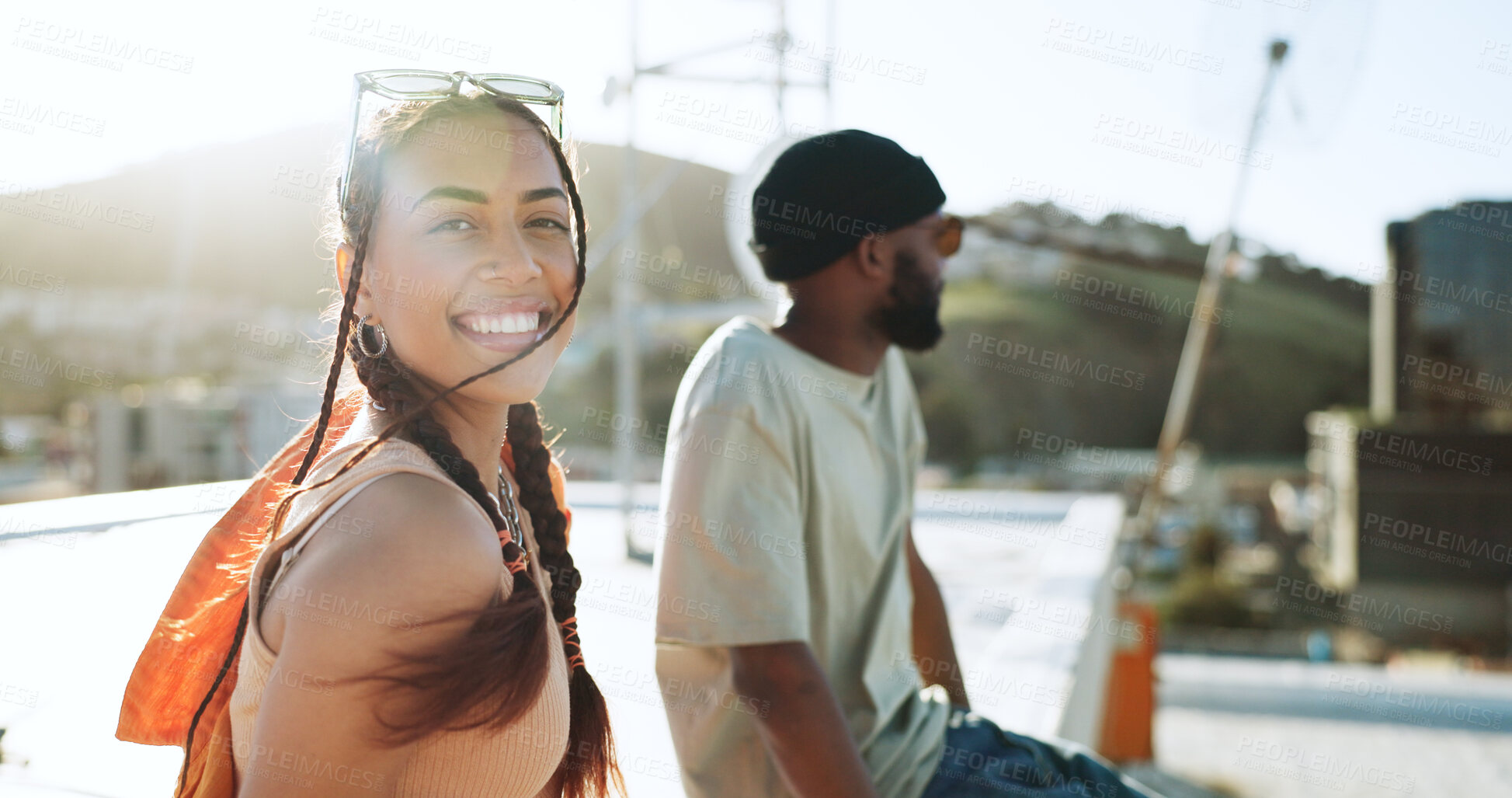 Buy stock photo Wind, smile and woman on city rooftop outdoor in summer, Portugal holiday or vacation location with style, trendy or cool clothes. Portrait, happiness and person or tourist sightseeing with black man