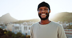 Face, happy and street style with a black man outdoor in the city with nature in the background during summer. Portrait, fashion and urban with a handsome young male standing outside in a bright town