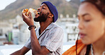 Couple, eating pizza and bonding on city building rooftop in Miami, Florida while dancing, enjoying and relaxing. Smile, happy black man and woman with fast food in relax tourist location for summer